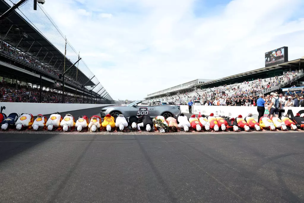 osef Newgarden, driver of the #2 PPG Team Penske Chevrolet, kisses the bricks after winning The 107th Running of the Indianapolis 500 at Indianapolis Motor Speedway on May 28, 2023 in Indianapolis, Indiana.