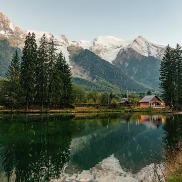 Beautiful view of Lac des Gaillands with Mont Blanc massif and wooden chalet in Chamonix town at French Alps, Savoie, France. 