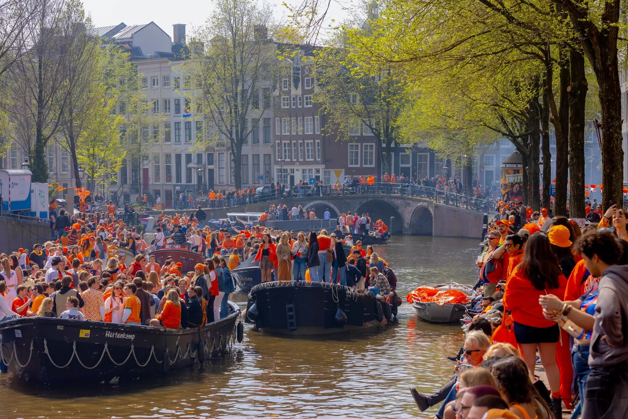 AMSTERDAM, THE NETHERLANDS - April 26, 2025: National King's Day (Koningsdag) Canals party celebration birthday of the King, Open-air fun, In the streets, Parks, City is bursting with orange, Holland., License Type: media, Download Time: 2026-03-17T15:37:32.000Z, User: LP_KBaxter, Editorial: true, purchase_order: 65050 - Digital Destinations and Articles, job: lonely planet, client: 20 things to know before traveling to Amsterdam, other: Kathleen Baxter