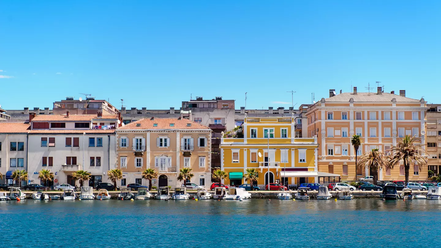Zadar, orange houses, turquoise sea and blue sky, Croatia.