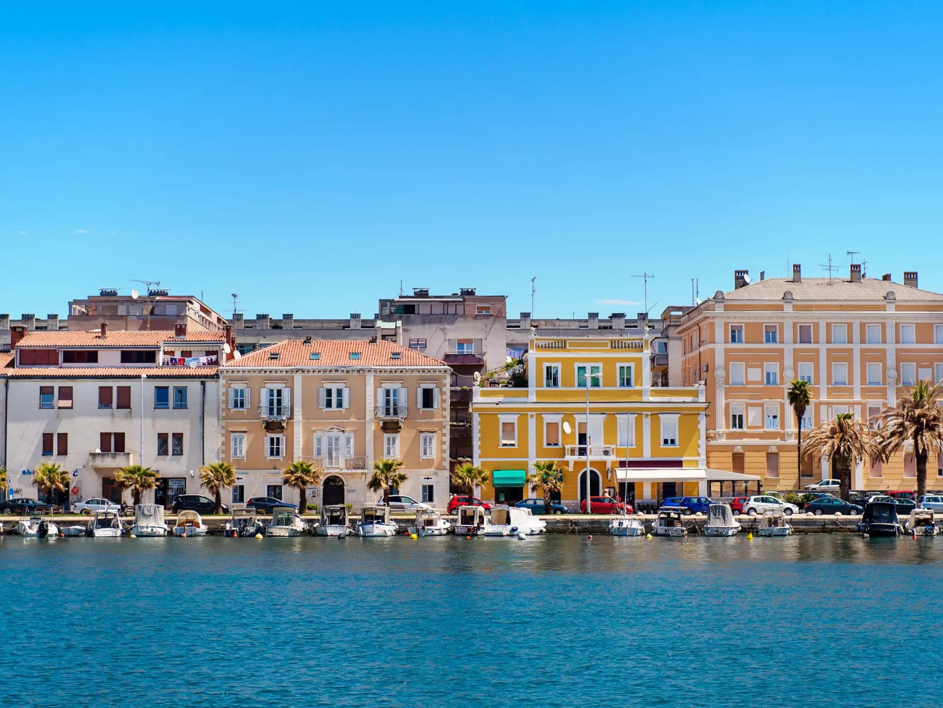 Zadar, orange houses, turquoise sea and blue sky, Croatia.