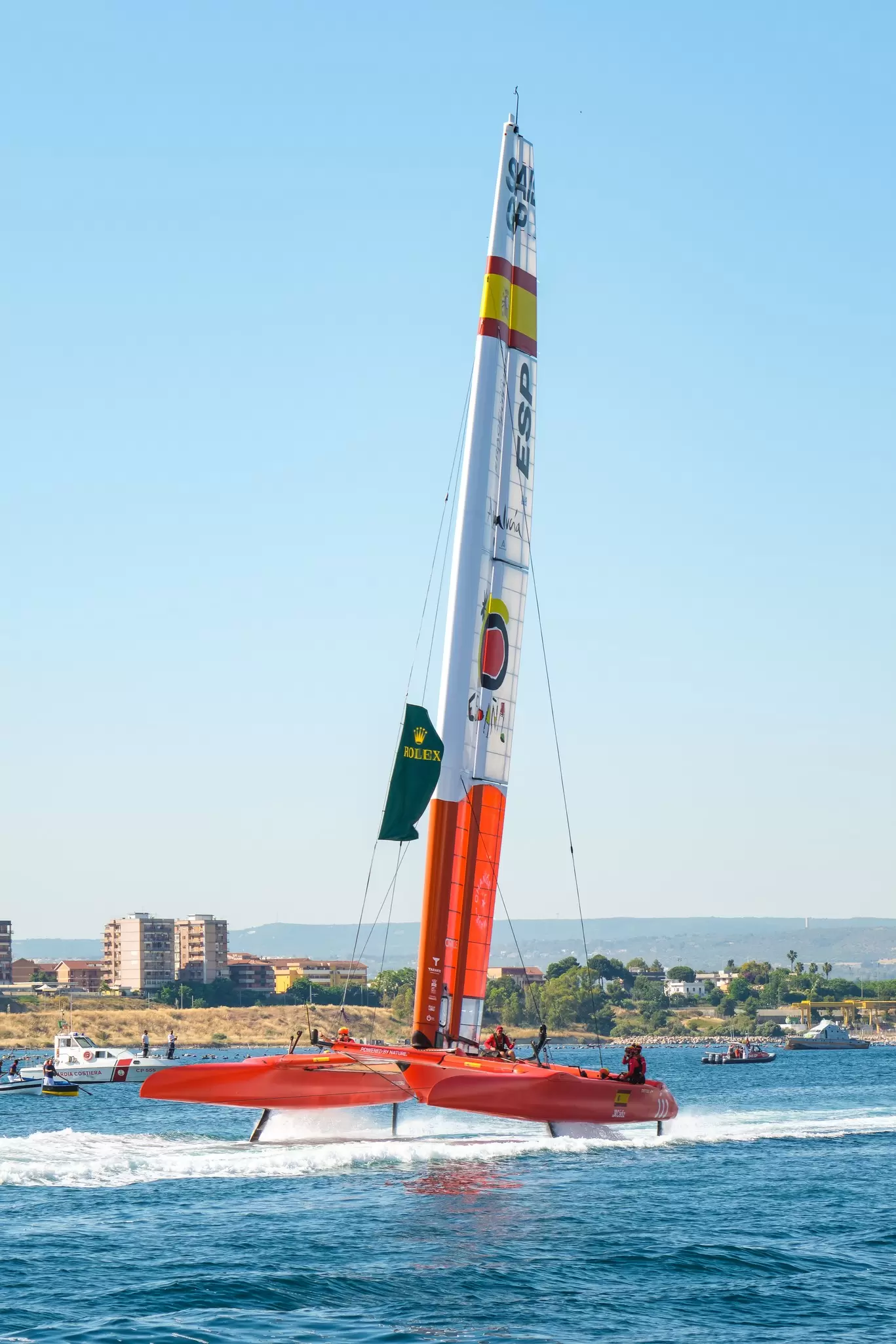 Taranto, Italy - June 4, 2021: Grand Prix F50 catamarans during the inaugural parade seen frontally as they cross the navigable canal, Spanish team., License Type: media, Download Time: 2025-09-02T21:15:01.000Z, User: rhylton_redventures, Editorial: true, purchase_order: 65050 - Digital Destinations and Articles, job: Lonely Planet, client: social guide to extreme sports, other: Rhianydd Hylton