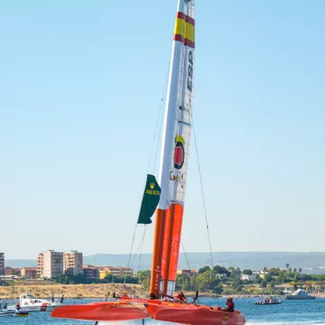 Taranto, Italy - June 4, 2021: Grand Prix F50 catamarans during the inaugural parade seen frontally as they cross the navigable canal, Spanish team., License Type: media, Download Time: 2025-09-02T21:15:01.000Z, User: rhylton_redventures, Editorial: true, purchase_order: 65050 - Digital Destinations and Articles, job: Lonely Planet, client: social guide to extreme sports, other: Rhianydd Hylton