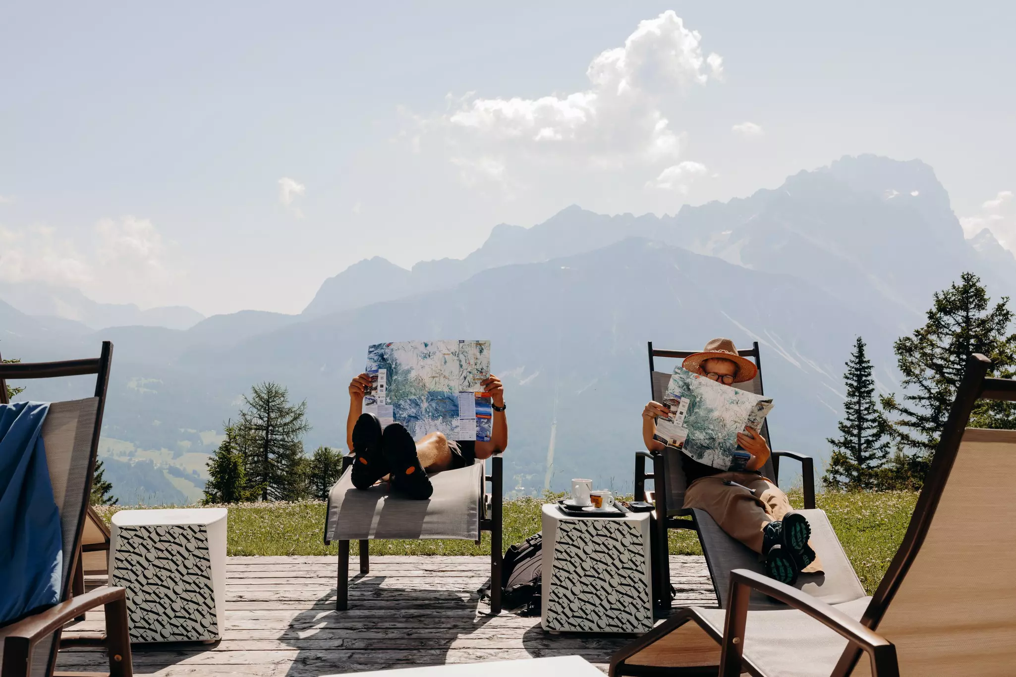 Cortina d'Ampezzo, Italy. June 2025. ..At Col Druscié stop (1778m), people enjoy the sun and relax. The Freccia nel Cielo (Arrow in the Sky) lift, which reaches the top of the Tofane Mountains and has three stops: Col Druscié at 1778m, Ra Valles at 247...