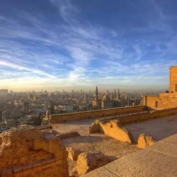The cityscape of Cairo at sunset from the Citadel and the Mosque of Muhammad Ali. 