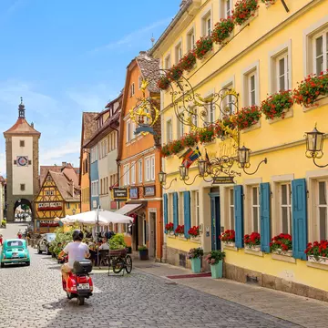 Schmiedgasse street in the historic old town of Rothenburg ob der Tauber during summer.