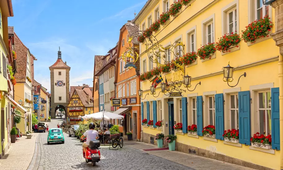 Schmiedgasse street in the historic old town of Rothenburg ob der Tauber during summer.