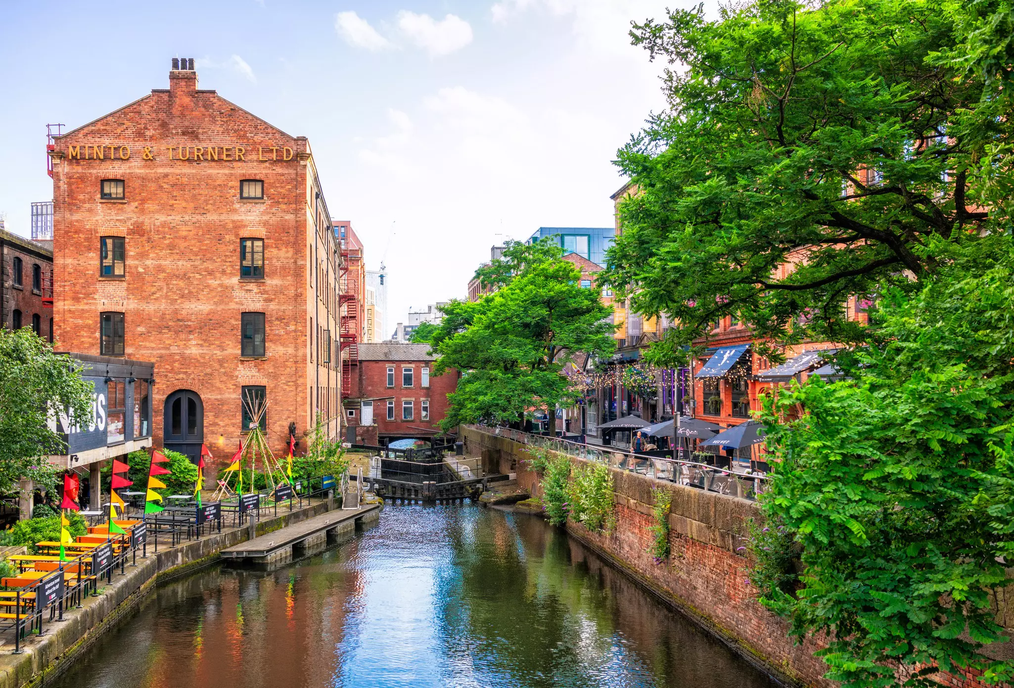 Bars line either side of a canal in a formerly industrial area of warehouses and mills