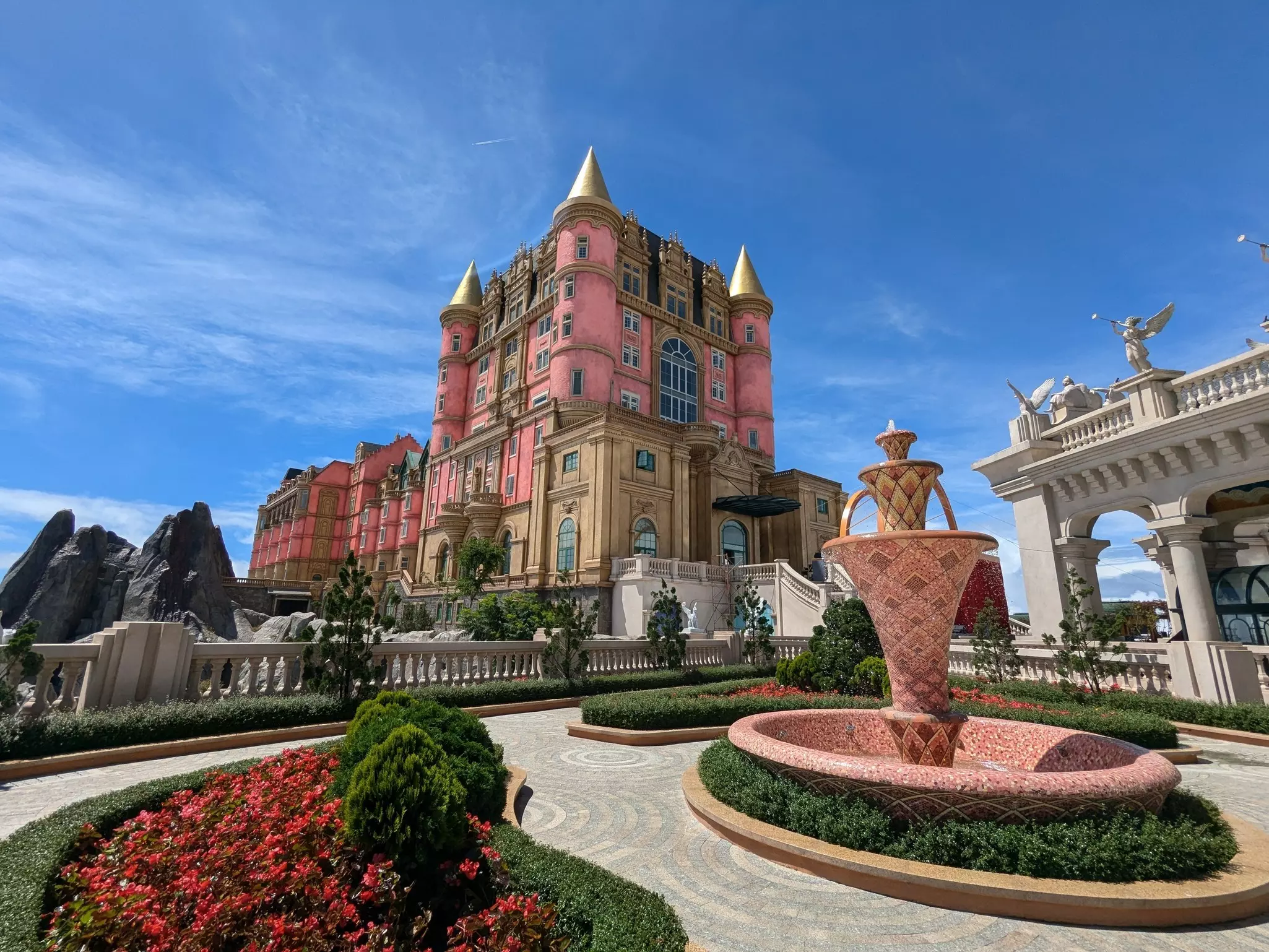 Luna castle and Lava castle in Ba Na Hills, with pretty gardens in the foreground