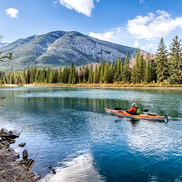 Kayaker on the Bow river near Banff