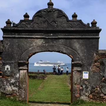 View of a cruise ship through the Santa Barbara fortress while she heads to Trujillo, 600km north of Tegucigalpa on October 15, 2014.    AFP PHOTO / Orlando SIERRA        (Photo credit should read ORLANDO SIERRA/AFP/Getty Images)