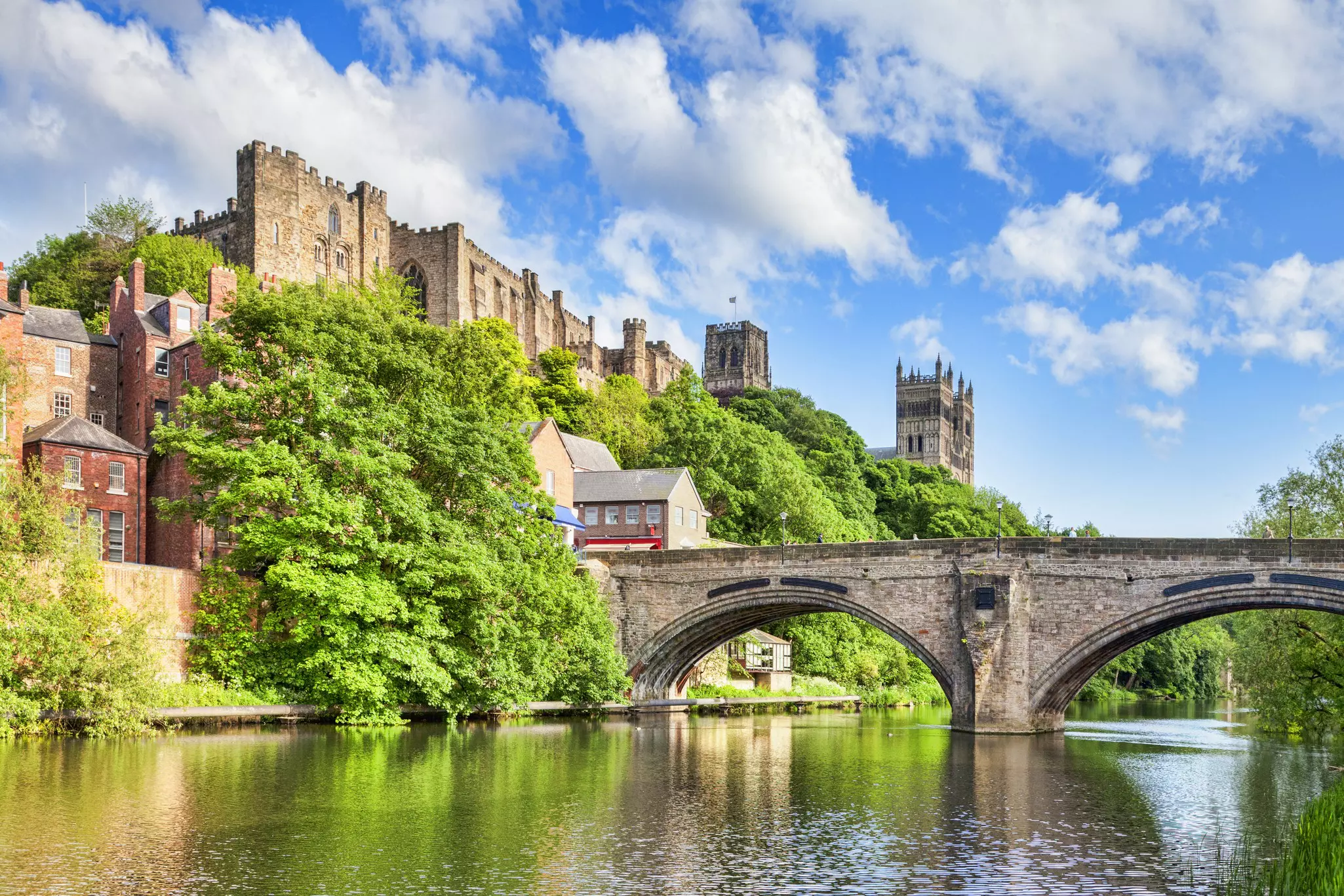 Durham Castle and Cathedral on their rock above the city, and Framwellgate Bridge spanning the River Wear, England.