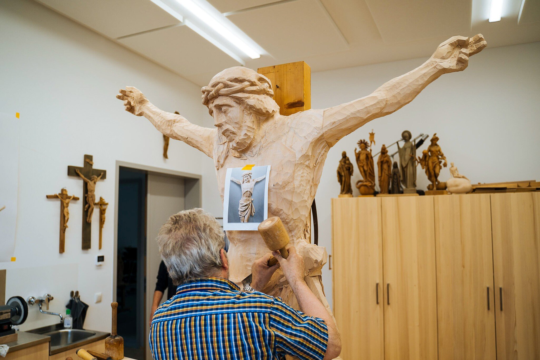 A 15th generation wood carver, Josel Albl, works on a sculpture in Oberammergau, Germany.