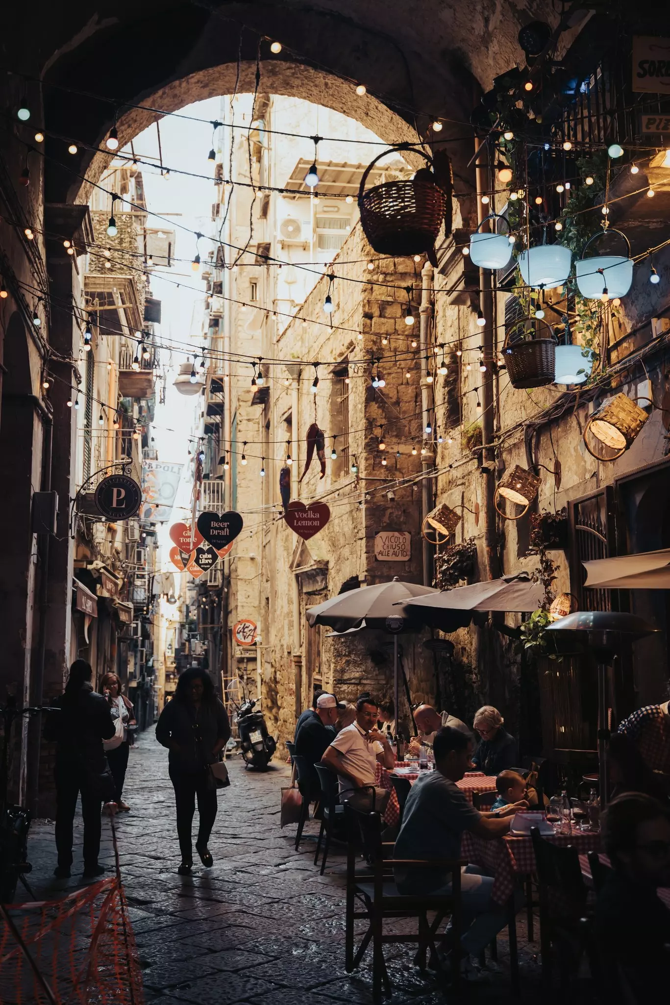 Charming streets of Naples, Italy, featuring narrow alleys, colorful buildings, local life, and vibrant Mediterranean atmosphere in the historic city center.