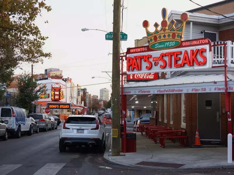 Two of Philly's most popular cheesesteak spots are side-by-side: Pat's and Geno's. Bryan Littel/Shutterstock