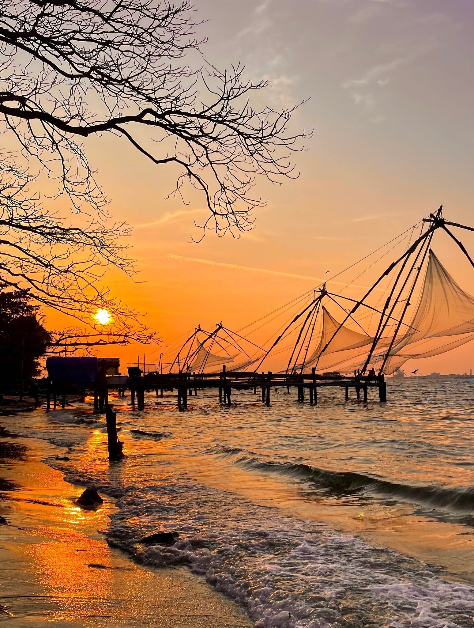 Chinese fishing net (Cheenavala) at sunset in Fort Kochi, Kerala, India.