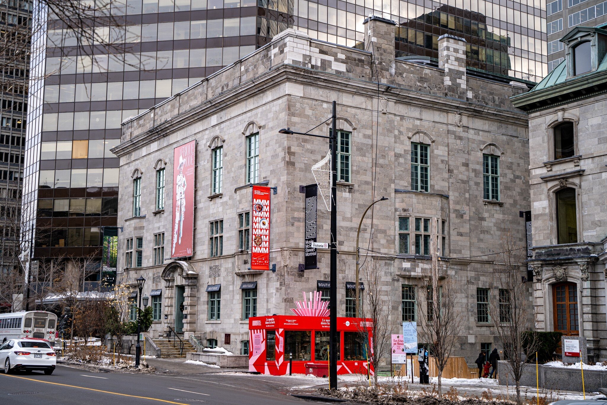 Montreal, QC/Canada - 6/26/2020: a combination of old and modern architecture at the same scene, the historical building of McCord museum with a background of a modern building of McGill University.