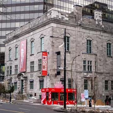 Montreal, QC/Canada - 6/26/2020: a combination of old and modern architecture at the same scene, the historical building of McCord museum with a background of a modern building of McGill University.