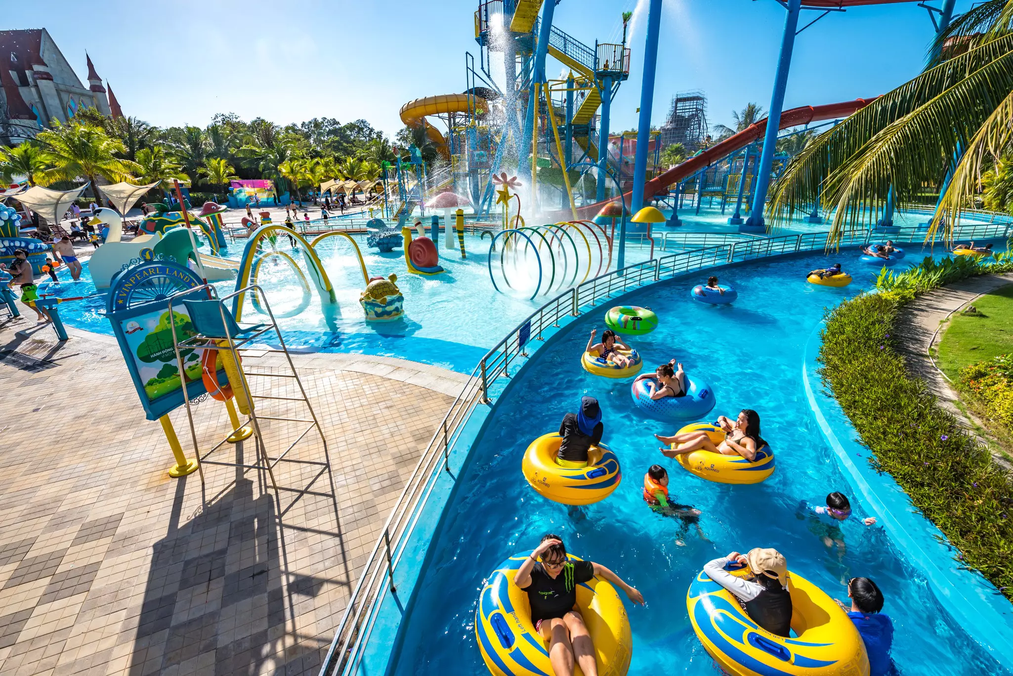 Families enjoying the water at an amusement park on Phu Quoc island, Vietnam.