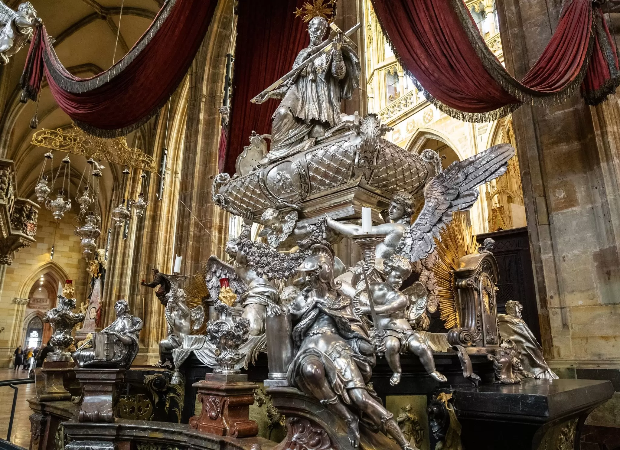 View of the baroque silver tomb of St John of Nepomuk within St. Vitus Cathedral in Prague, Czechia.