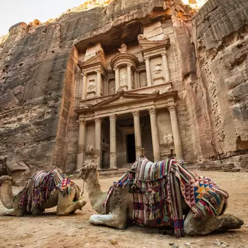 Bedouin camels resting near the treasury of Al Khazneh in Petra.