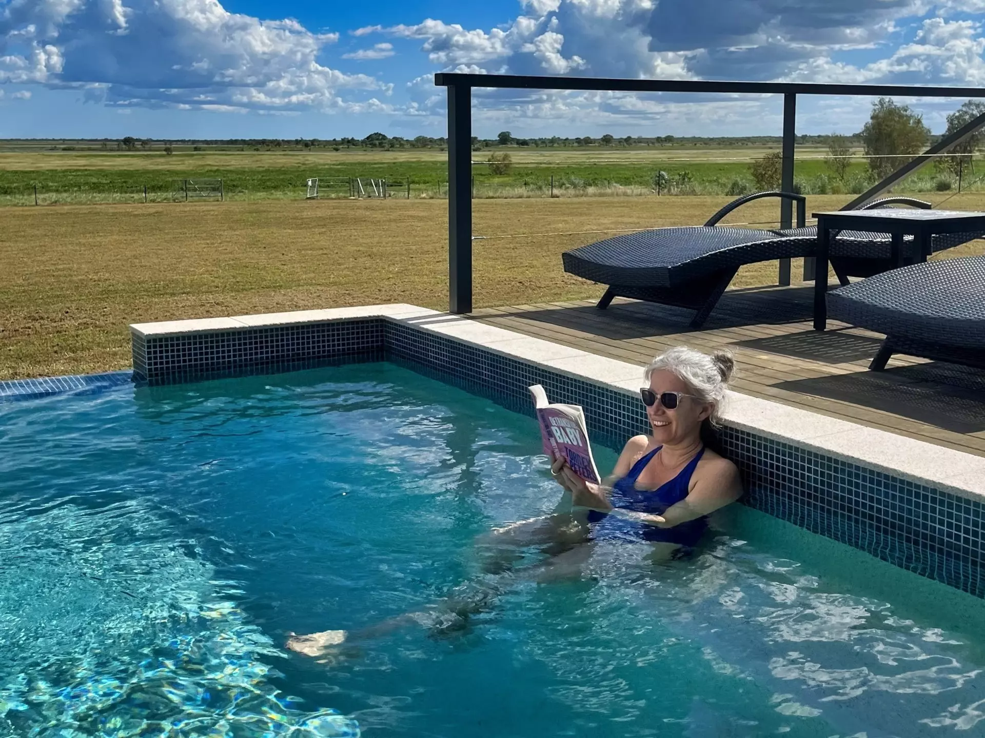 Writer Tasmin Waby relaxes in the pool at the Finniss River Lodge during a visit to Australia's Top End © Tasmin Waby / Lonely Planet