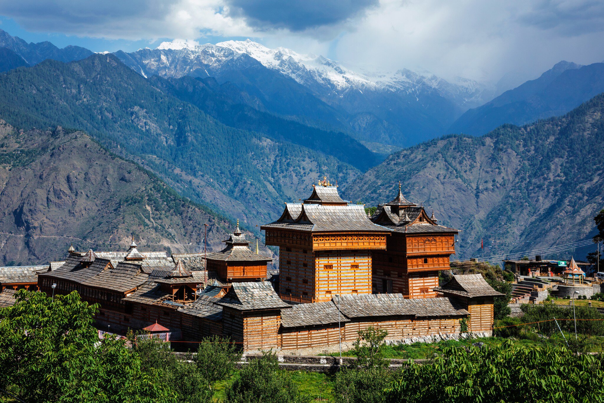 Wide exterior view of Bhimakali Temple dedicated to the mother goddess, with mountain range in background. Bhimakali, Sarahan, Kinnaur, Himachal Pradesh, India. 