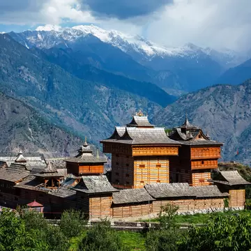 Wide exterior view of Bhimakali Temple dedicated to the mother goddess, with mountain range in background. Bhimakali, Sarahan, Kinnaur, Himachal Pradesh, India. 