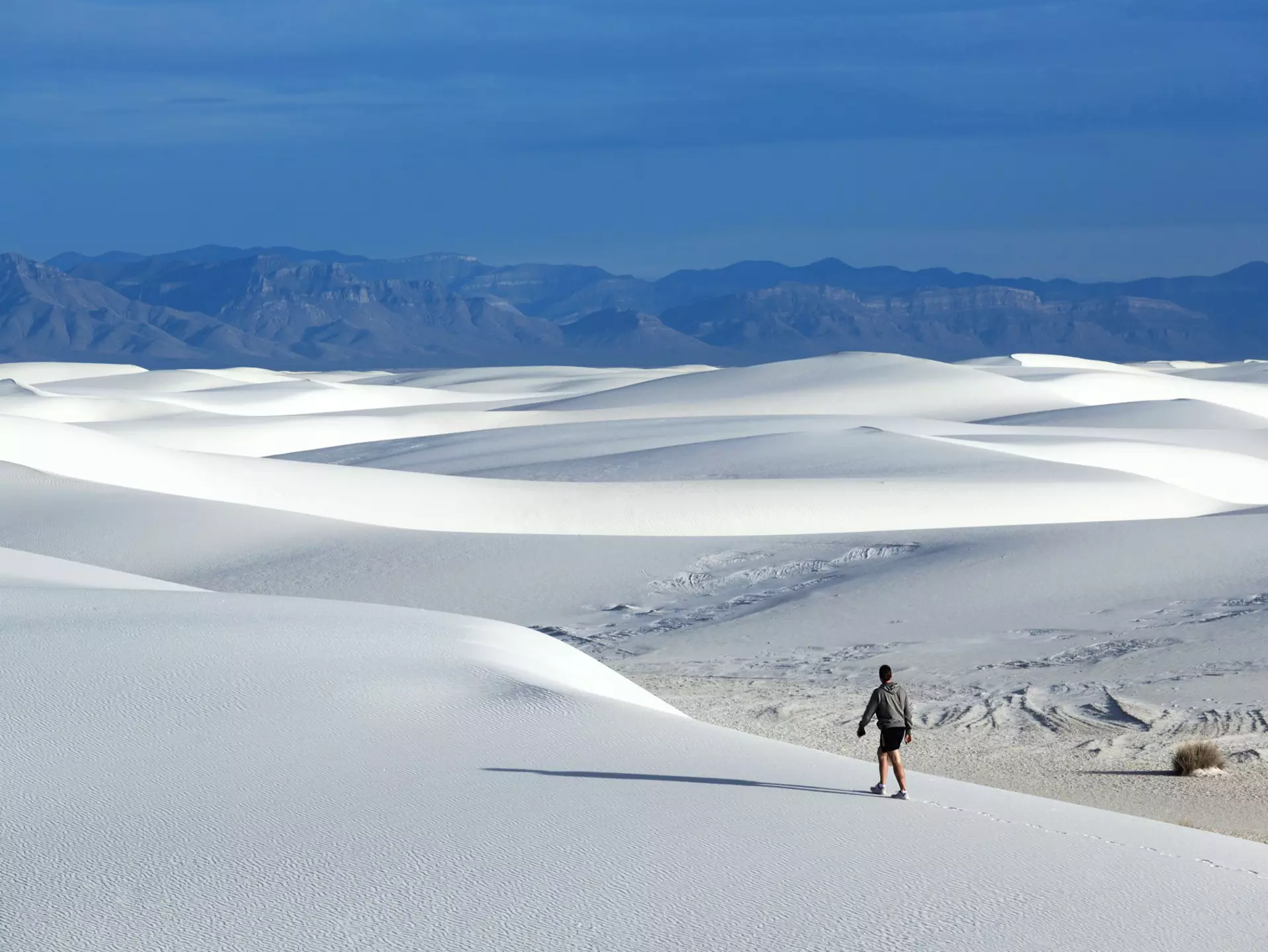 The spring and fall are great times to explore the rolling dunes of White Sands in New Mexico. Shutterstock.