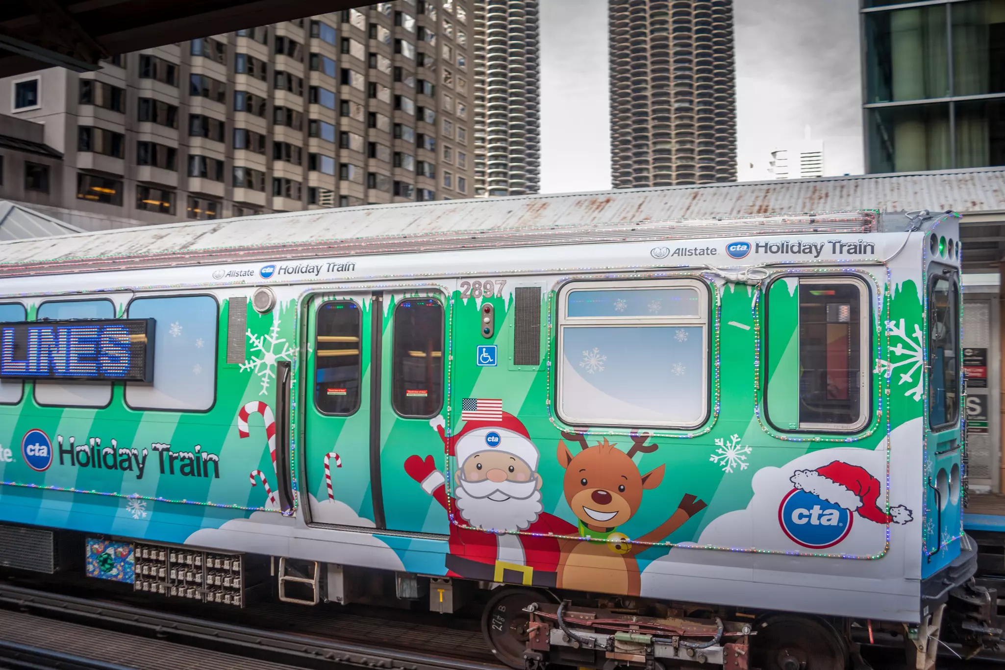 A city train with Christmas decorations on a track