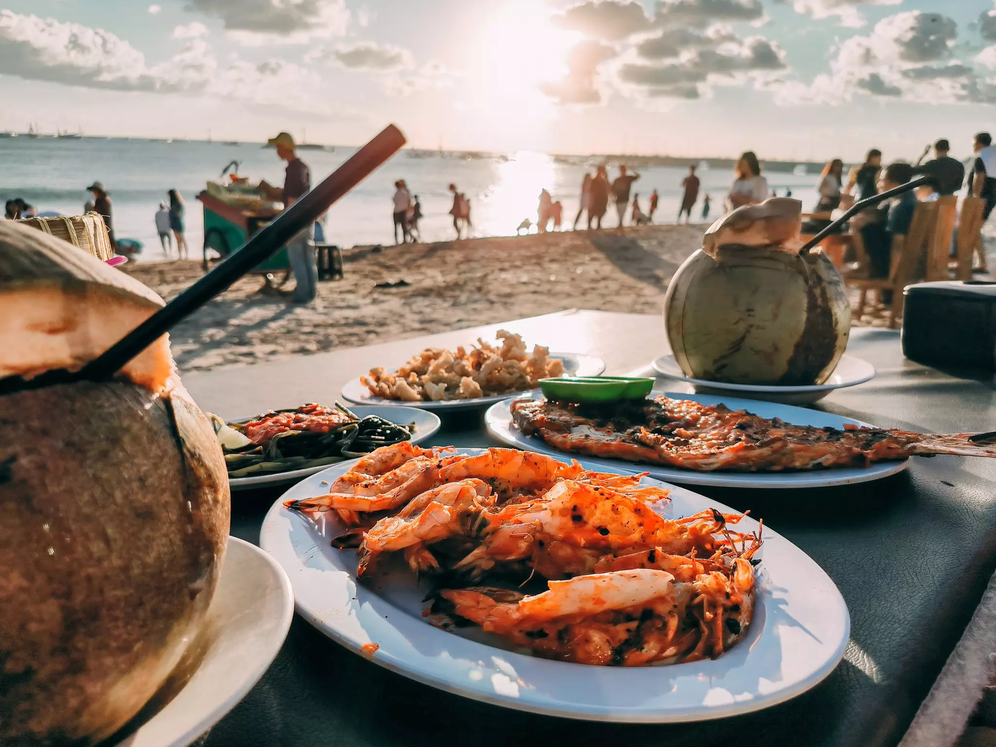 Platters of seafood at a beachside cafe.