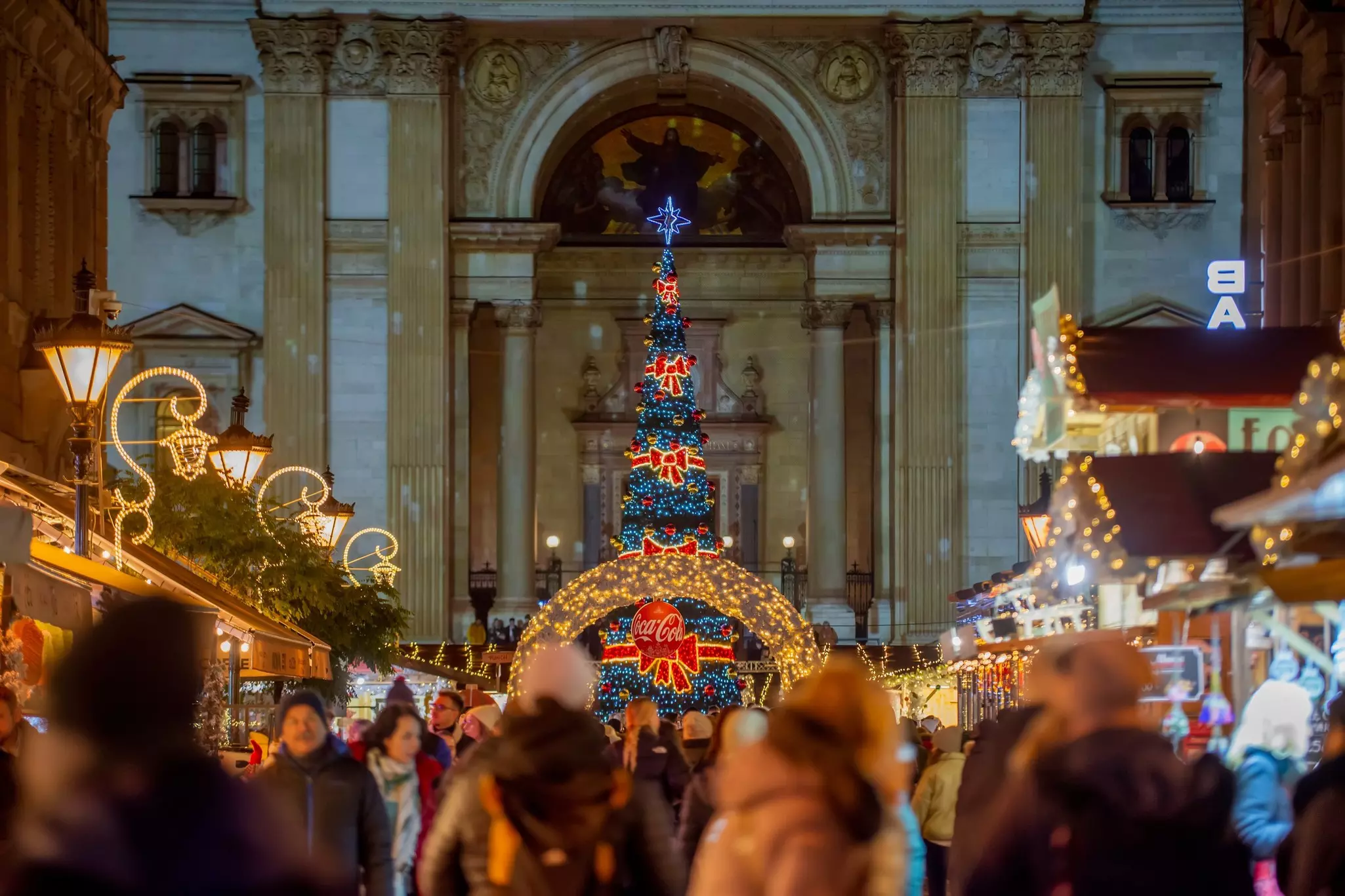 Budapest, Hungary DECEMBER 12, 2023 Christmas tree and market at Saint Stephen Basilica square in Budapest - front view, License Type: media, Download Time: 2025-04-09T20:01:03.000Z, User: rhylton_redventures, Editorial: true, purchase_order: 65050 - Digital Destinations and Articles, job: Lonely Planet, client: digital wip, other: Rhianydd Hylton