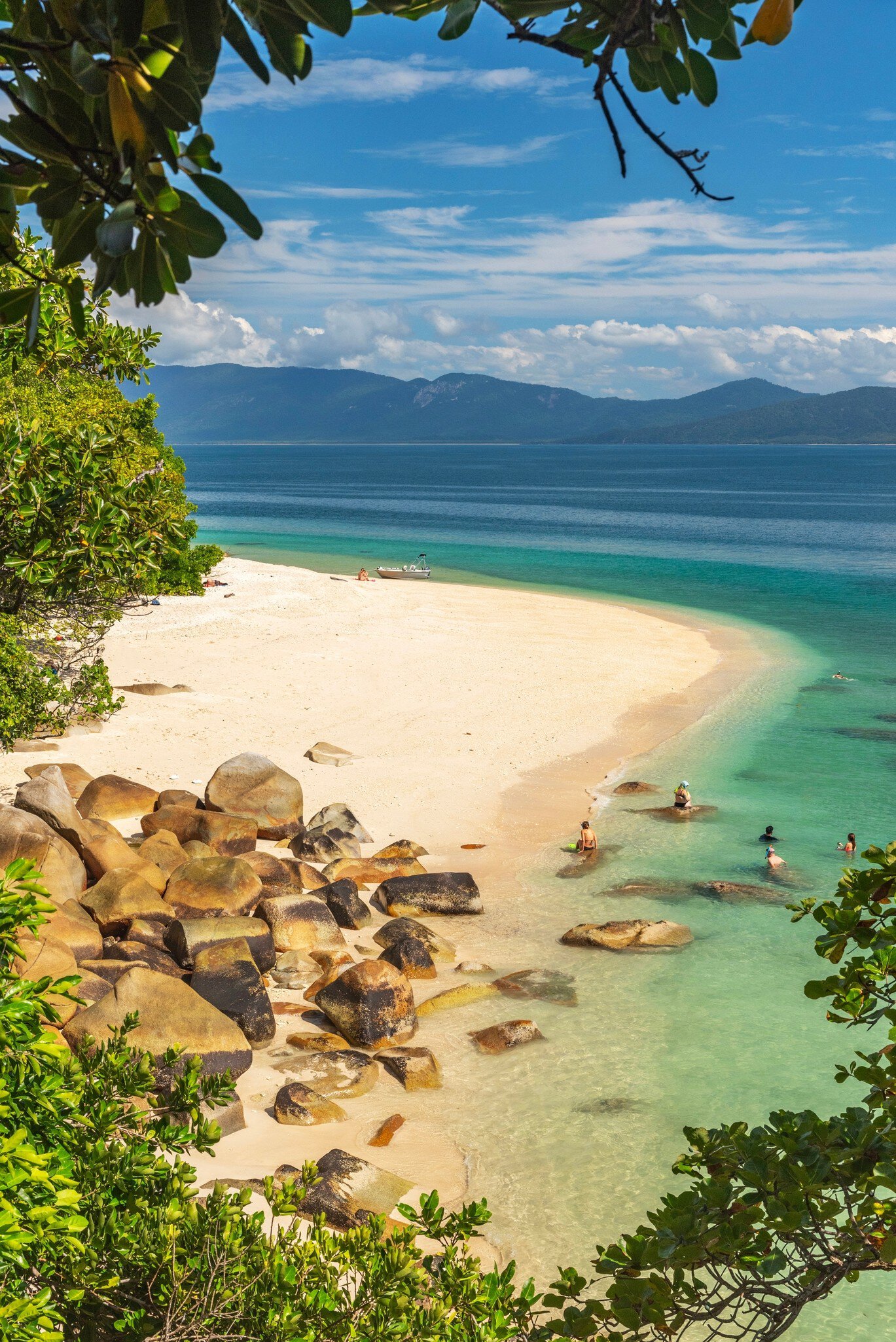 Tropical golden Nudey Beach with turquoise water on Fitzroy Island. It is a continental island southeast of Cairns, Queensland, Australia.