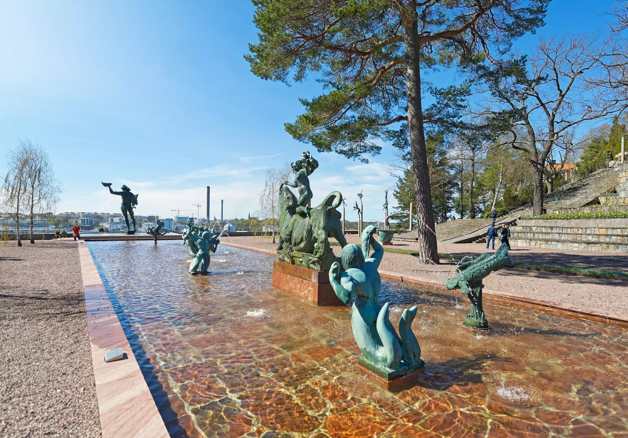 Sculptures of fish and mythical mer-people fill a water feature in a sculpture park at Millesgården on the island of Lidingö, Stockholm. 
