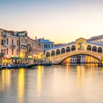 Early morning at the Rialto Bridge and Grand Canal, Venice. Eloi_Omella/Getty Images