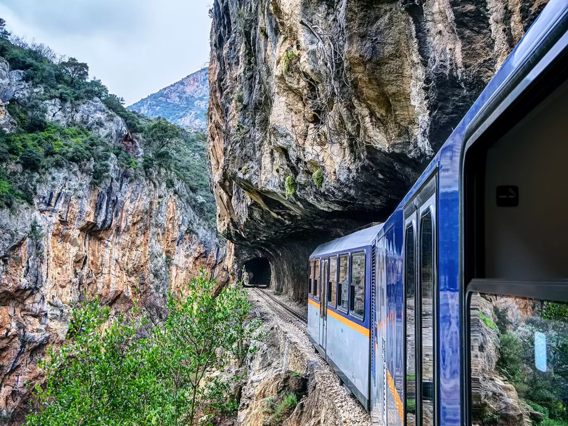 Odontotos rack railway Diakopto – Kalavrita in Vouraikos gorge, with tracks dug on rocky cliffs.