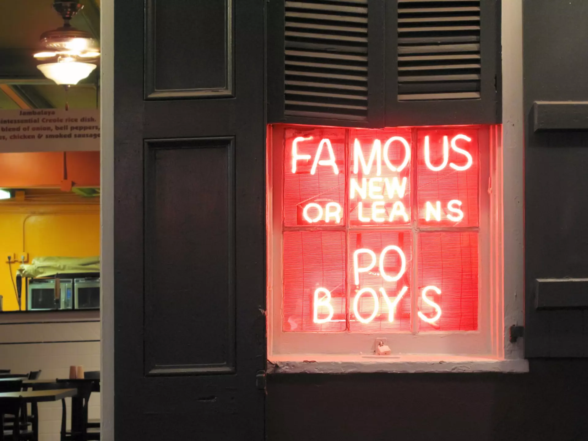 Neon sign advertising po'boy sandwiches in New Orleans, Louisiana. tacojim/Getty Images