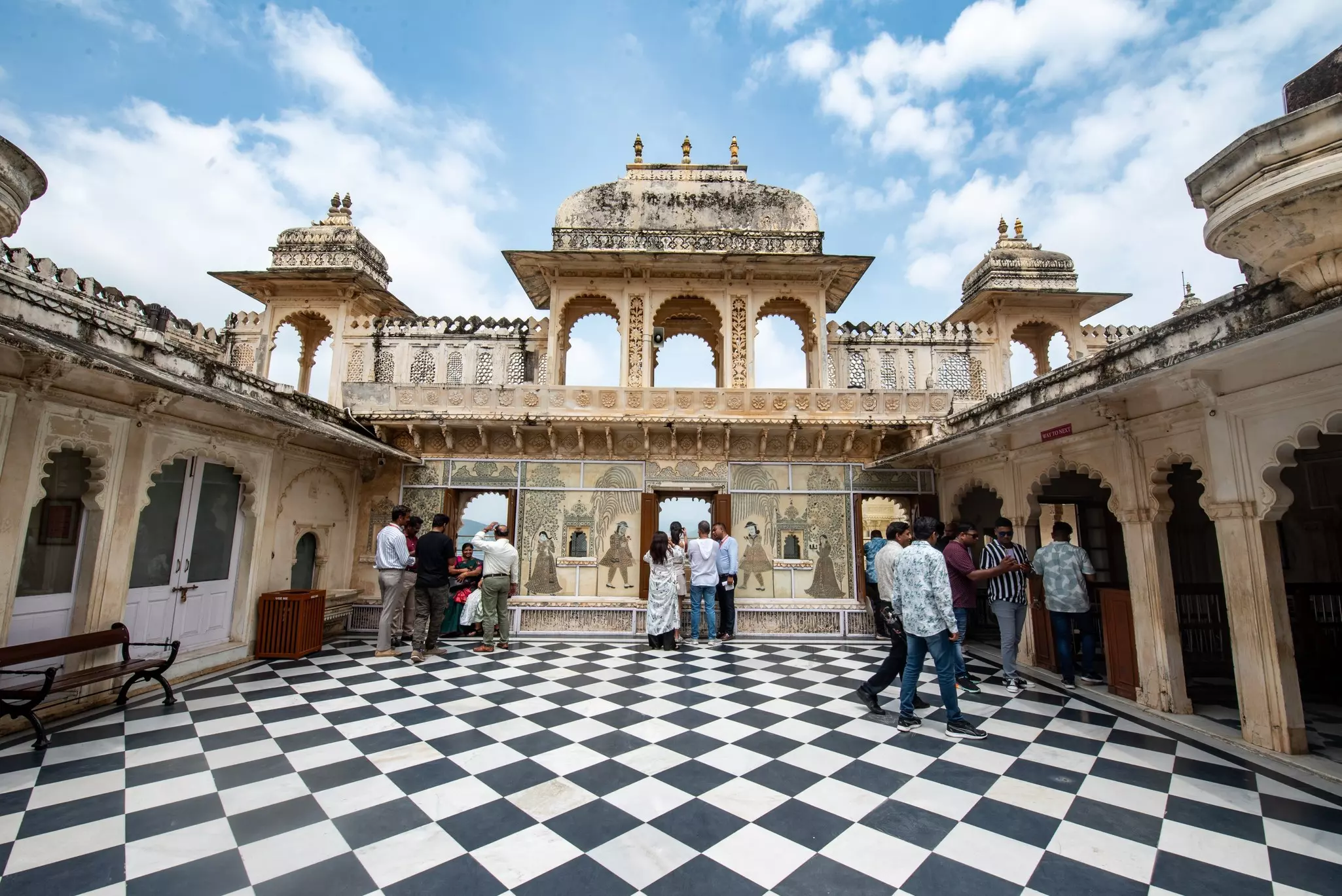 Tourists visit the City Palace of Udaipur, Rajasthan, India.
