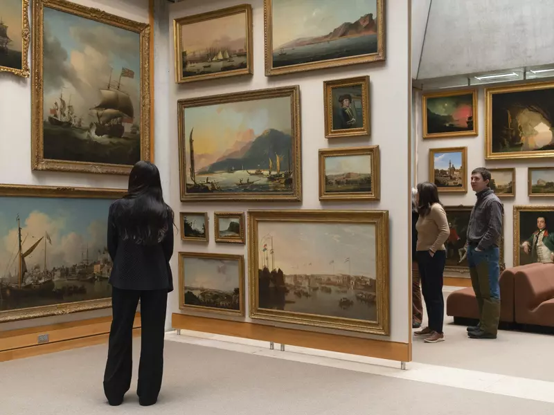 People look at paintings in the newly installed Long Gallery at the Yale Center for British Art