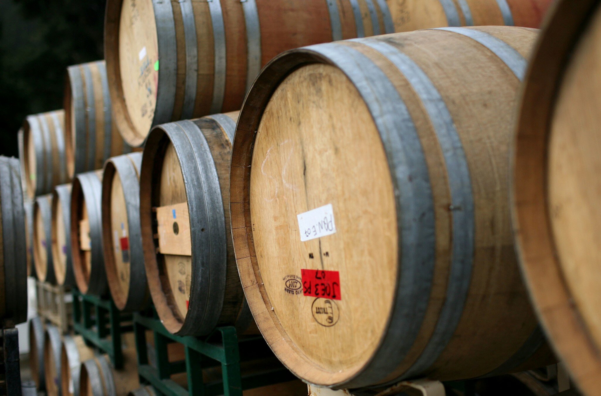 ST. HELENA, CA - SEPTEMBER 25: Rows of oak wine barrels sit on racks at Tres Sabores Winery September 25, 2009 in St. Helena, California. Tres Sabores, a certified organic winery, has strated to harvest their grapes for the 2009 vintage as winerie...