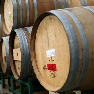 ST. HELENA, CA - SEPTEMBER 25: Rows of oak wine barrels sit on racks at Tres Sabores Winery September 25, 2009 in St. Helena, California. Tres Sabores, a certified organic winery, has strated to harvest their grapes for the 2009 vintage as winerie...
