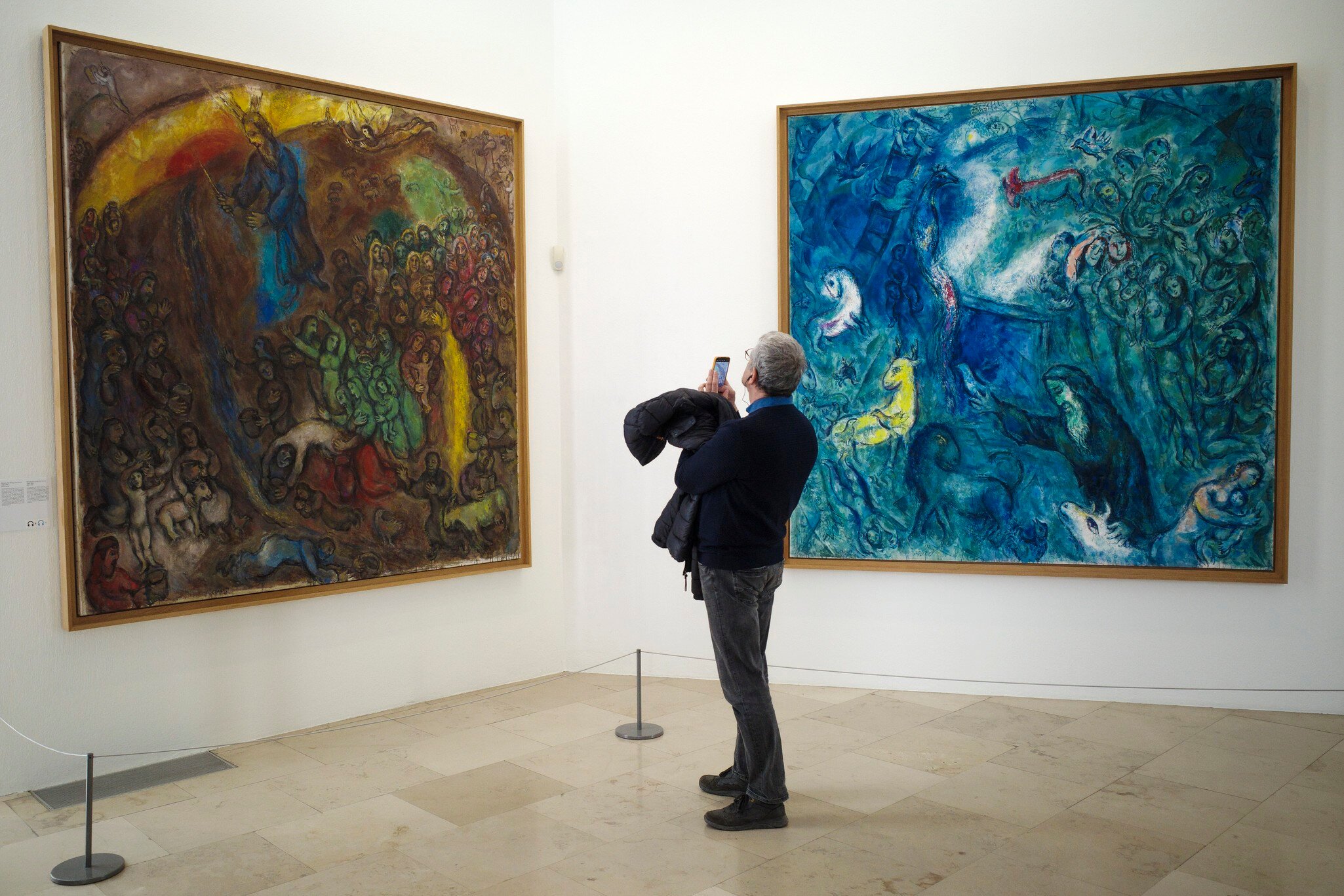 A visitor takes a photo in the Musee National Marc Chagall. The Marc Chagall National Museum is a museum dedicated to the work of Marc Chagall. Nice, France.