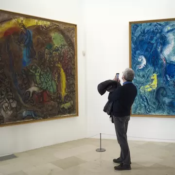 A visitor takes a photo in the Musee National Marc Chagall. The Marc Chagall National Museum is a museum dedicated to the work of Marc Chagall. Nice, France.