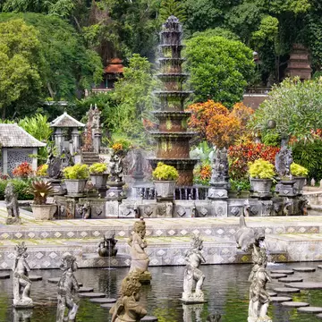 BALI, INDONESIA - March 2020: Beautiful fountains on the pond at Taman Tirta Gangga Holy Water Temple view in Bali, Indonesia  License Type: media  Download Time: 2024-03-18T03:20:43.000Z  User: mvm_lonelyplanet  Is Editorial: Yes  purchase_order:   