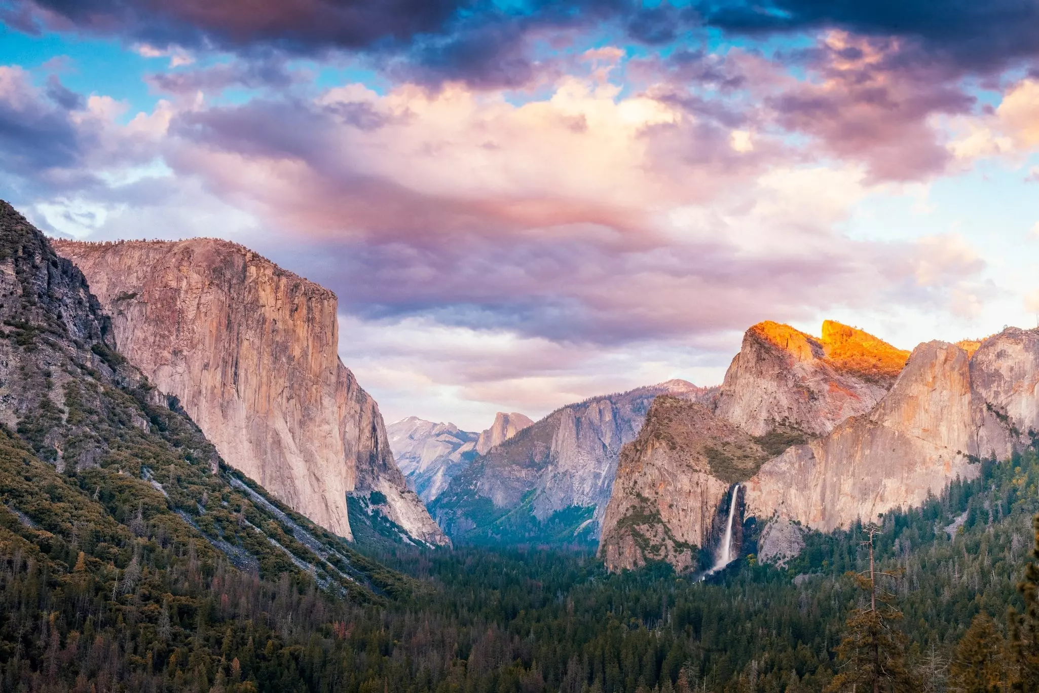 Evening view from the Tunnel View overlook in Yosemite National Park.  Seen are the icons of the park: El Capitan, Half Dome and Bridalveil Falls.