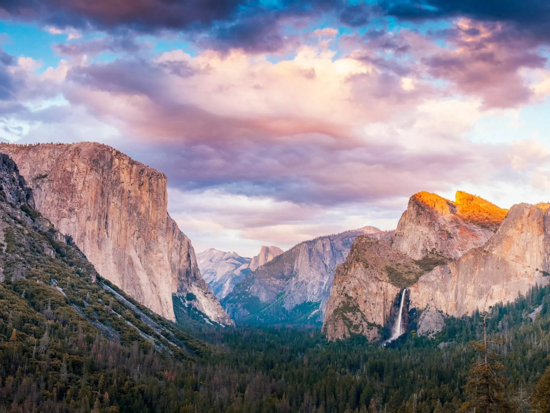 Evening view from the Tunnel View overlook in Yosemite National Park.  Seen are the icons of the park: El Capitan, Half Dome and Bridalveil Falls.