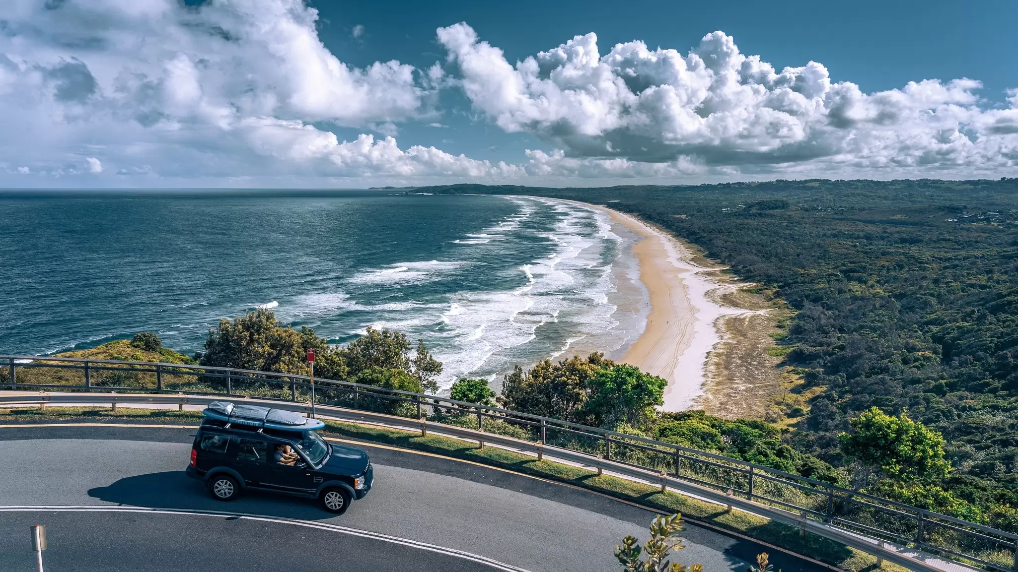 The golden sands of Byron Bay viewed from the road above. Alex Cimbal/Shutterstock
