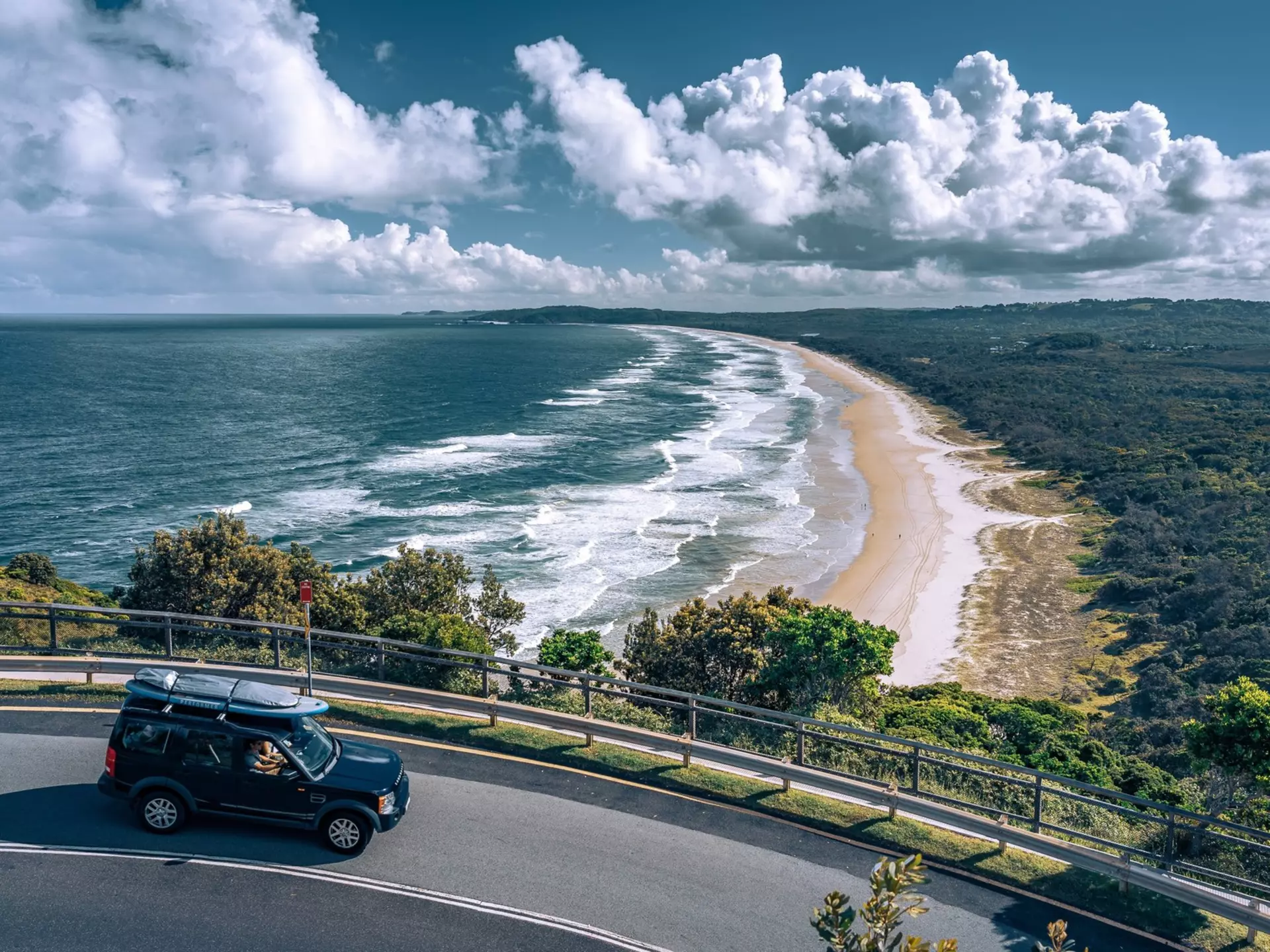The golden sands of Byron Bay viewed from the road above. Alex Cimbal/Shutterstock
