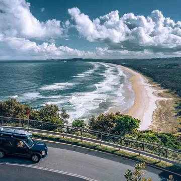 The golden sands of Byron Bay viewed from the road above. Alex Cimbal/Shutterstock
