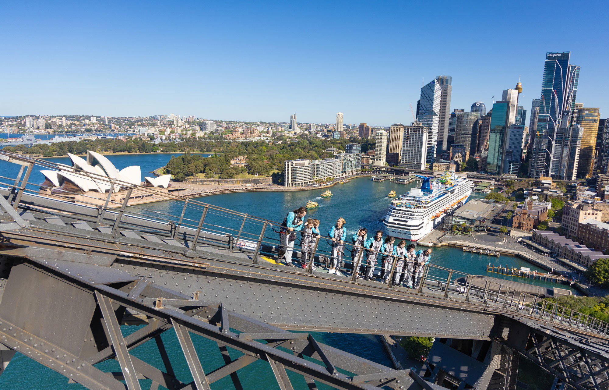 Group of people Climbing the Sydney Harbor Bridge with an Indigenous guide in Sydney, Australia. 